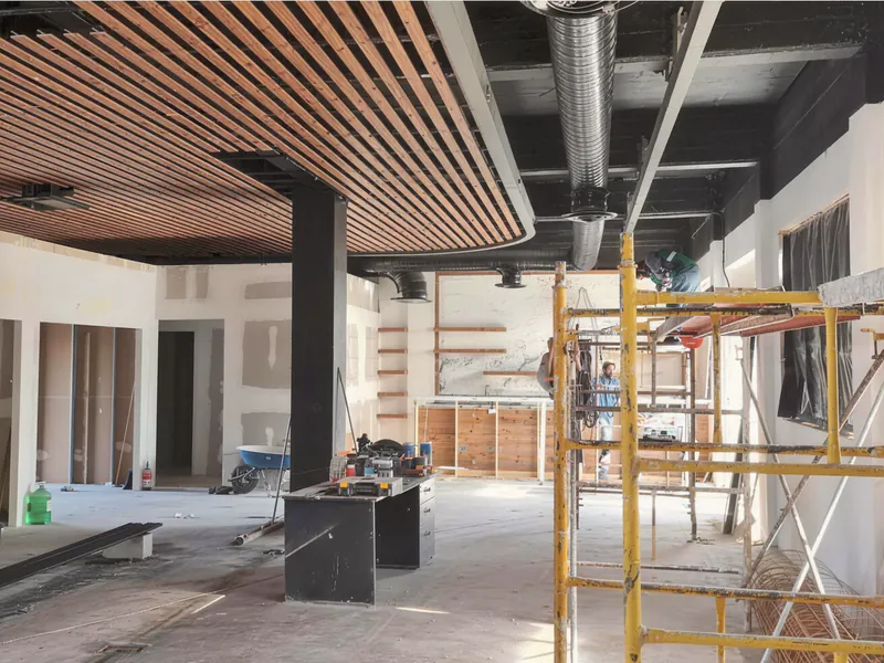 Before: a raw, unfinished commercial space