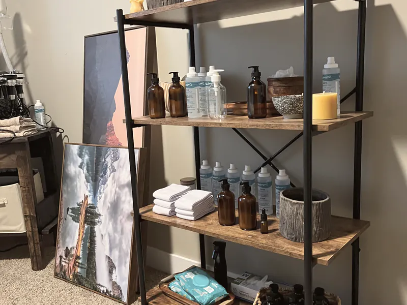 A styled retail shelf of products inside a home studio