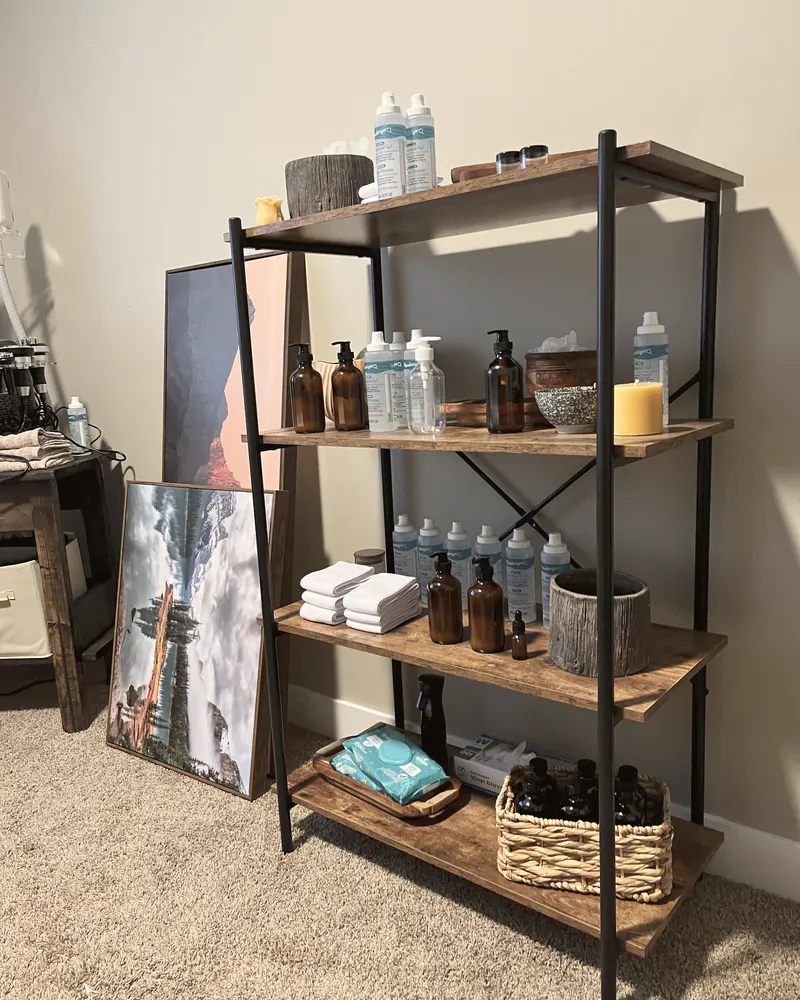 A styled retail shelf of products inside a home studio