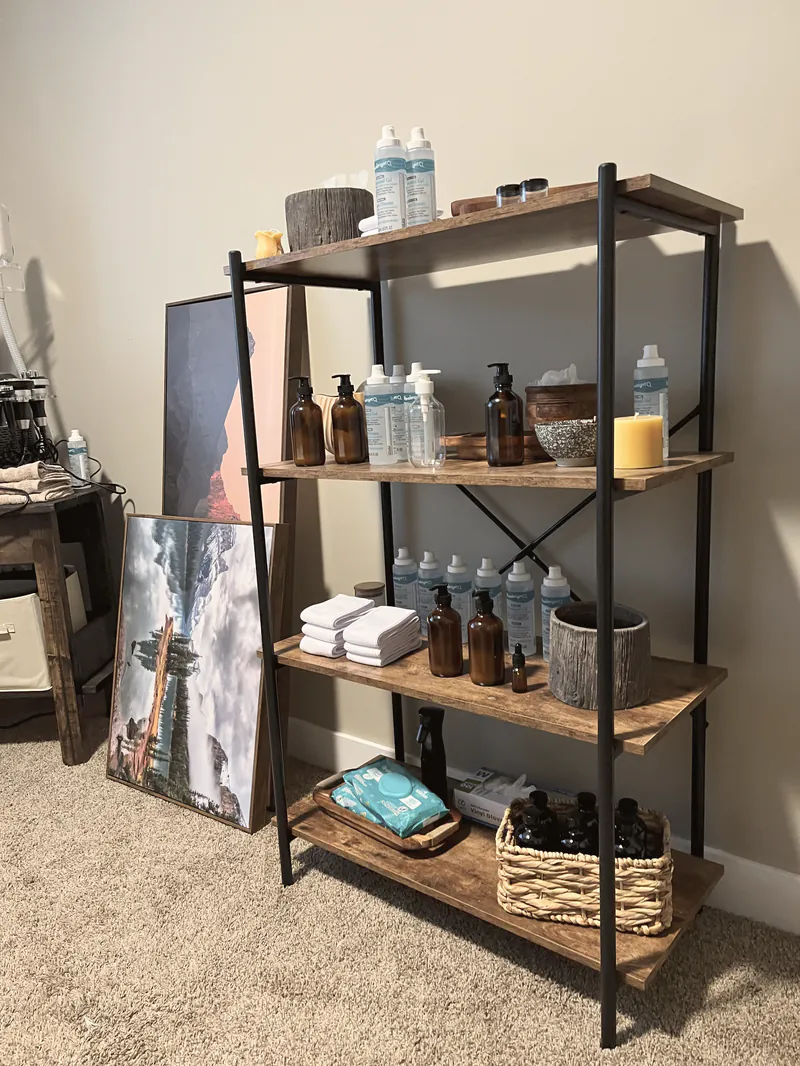 A styled retail shelf of products inside a home studio